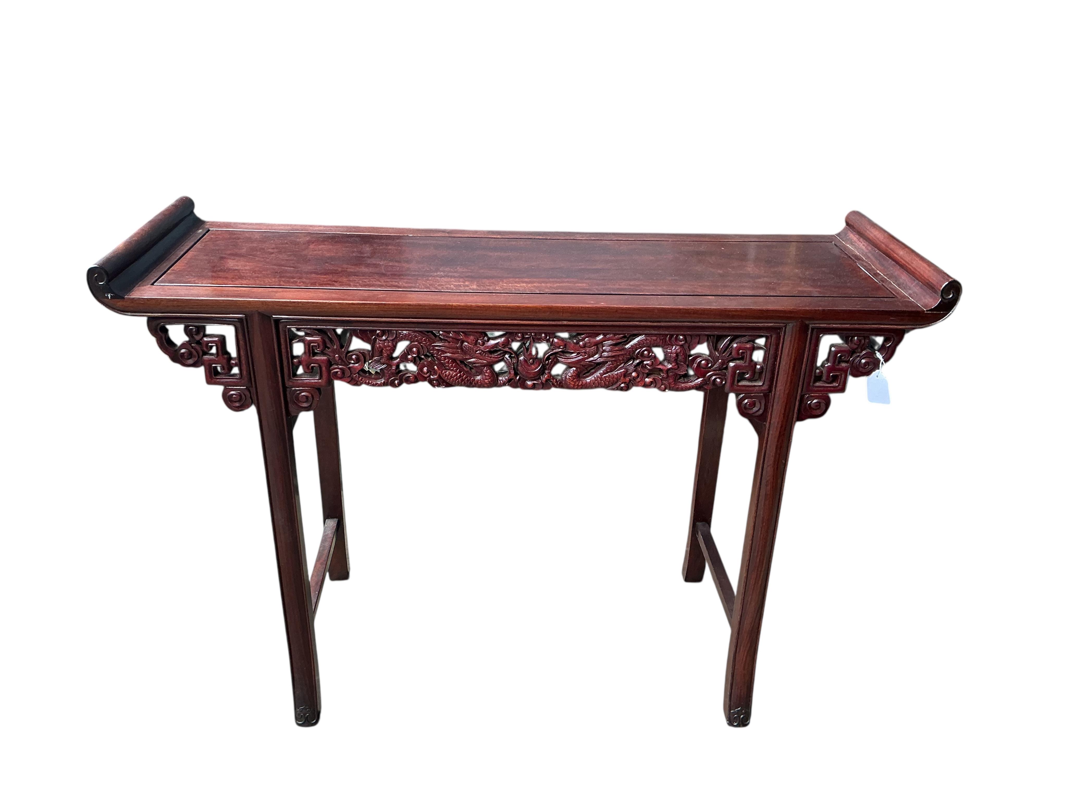 A Chinese altar table, width 122cm, depth 40cm, height 84cm